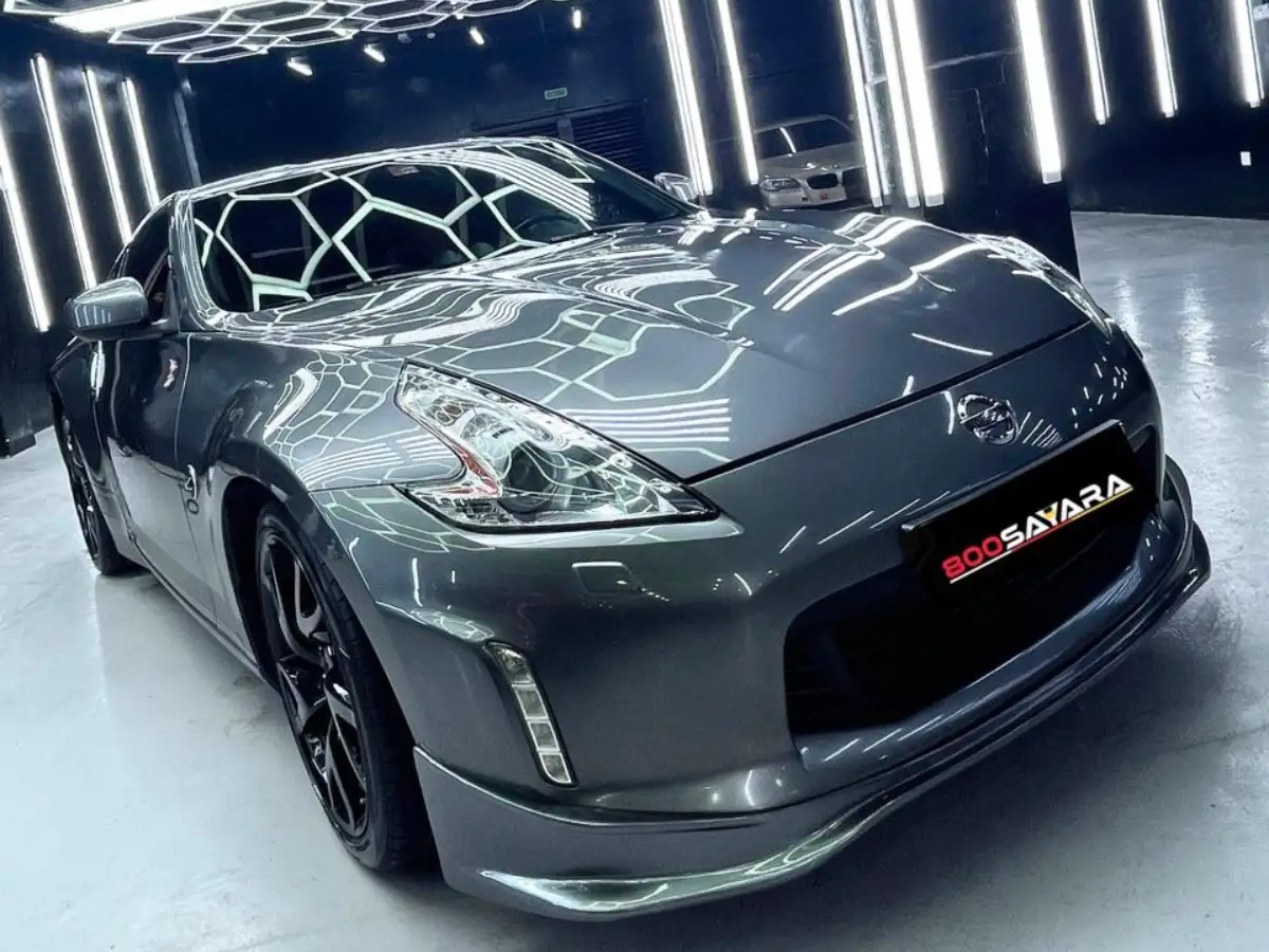 Nissan 370Z under hexagon lighting in the detailing studio