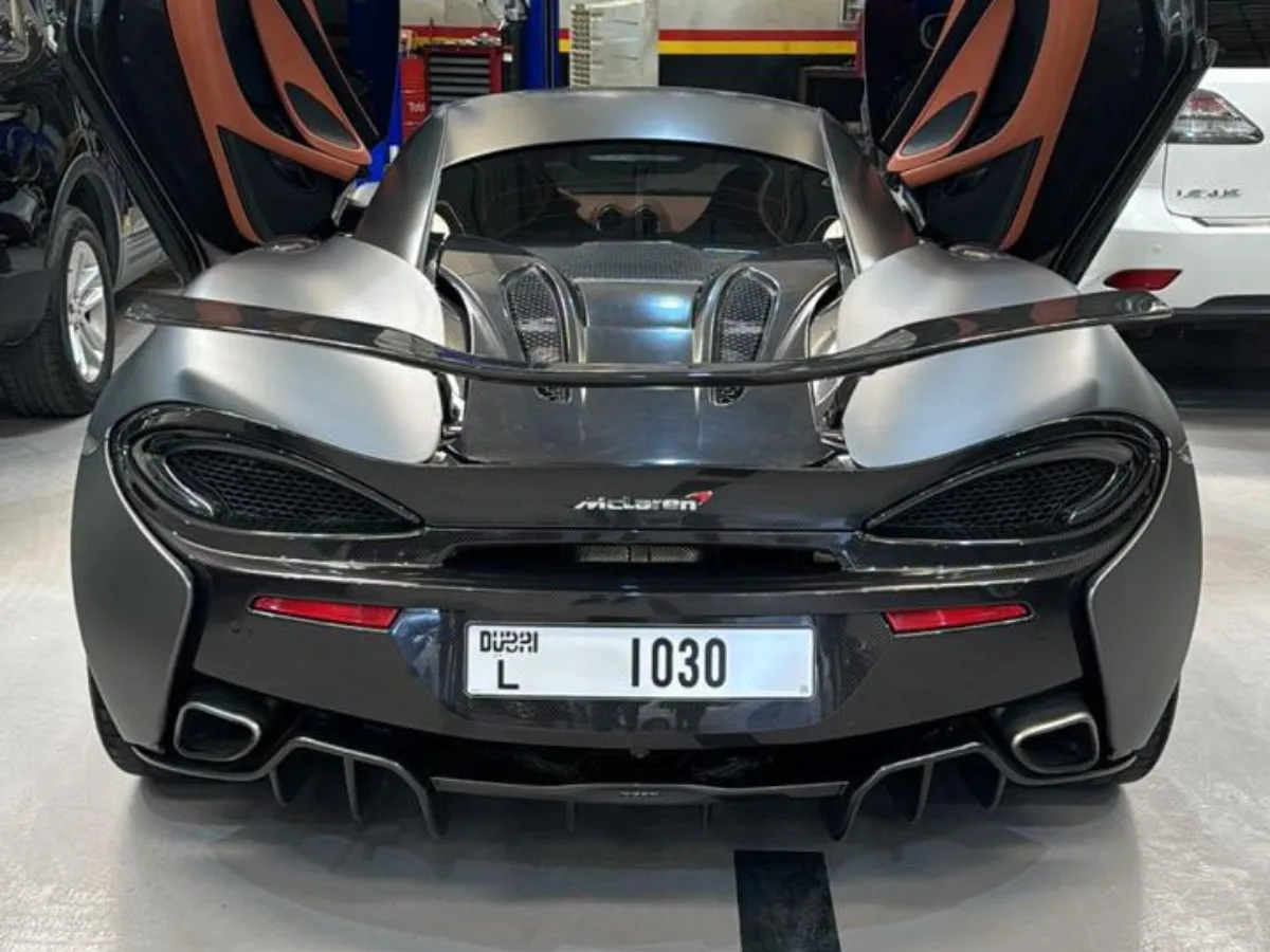 McLaren with doors raised inside the 800Sayara garage